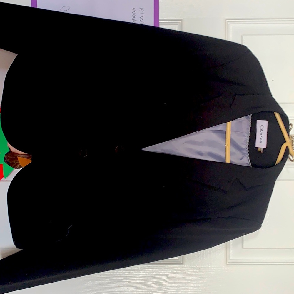 Calvin Klein blazer. Gently used. Black with black/gun metal buttons. Size 12.